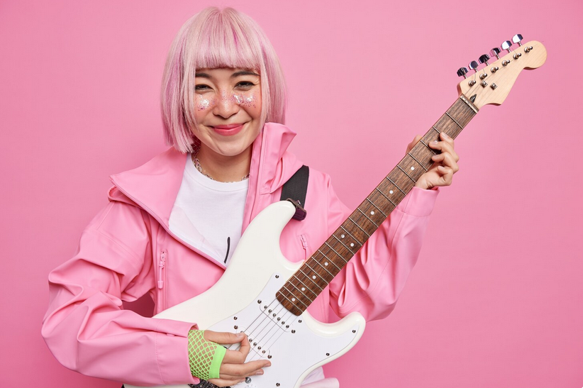 woman holding guitar